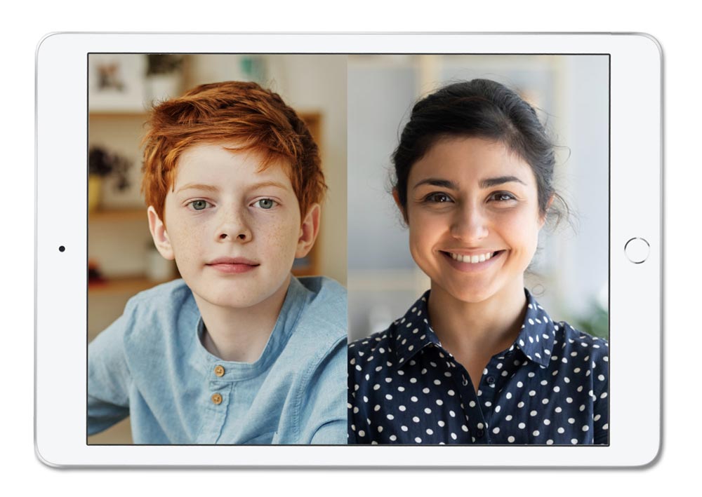 A tablet computer showing an image of a boy and a woman